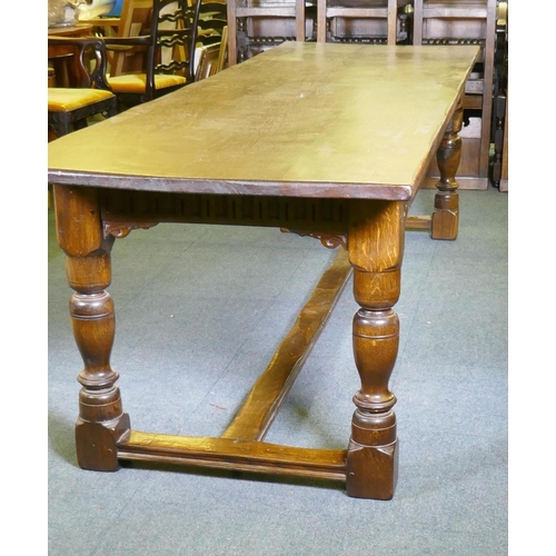 1032 - A William and Mary style oak refectory table, with planked top and carved frieze, raised on baluster... 