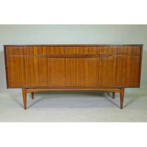 1149 - A mid-century Elliotts of Newbury afromosia sideboard, with single drawer and three cupboards, 152 x... 