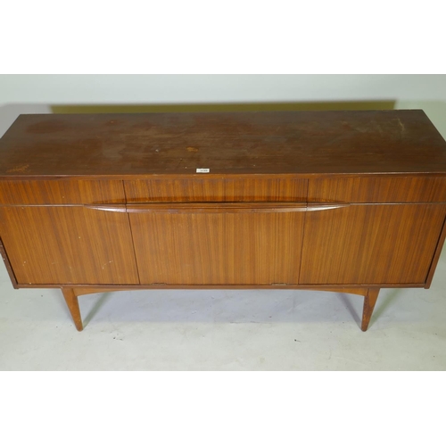 1149 - A mid-century Elliotts of Newbury afromosia sideboard, with single drawer and three cupboards, 152 x... 