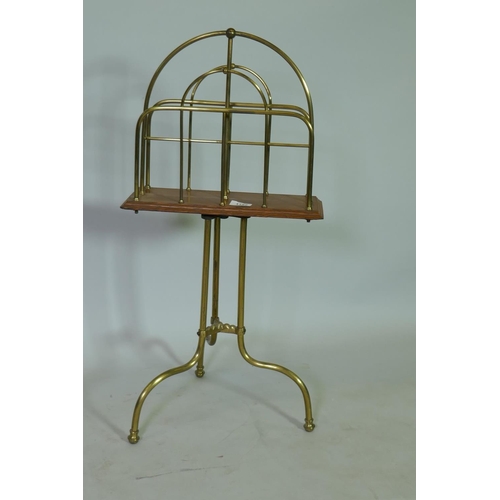 1152 - Early C20th oak and brass revolving magazine rack, stamped Hail BM, 76cm high