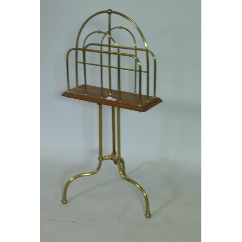 1152 - Early C20th oak and brass revolving magazine rack, stamped Hail BM, 76cm high