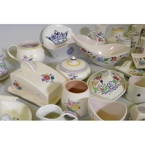 16 - A large collection of Poole Pottery in the traditional pattern, 1940s and later