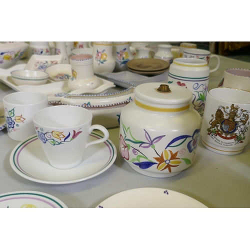 16 - A large collection of Poole Pottery in the traditional pattern, 1940s and later