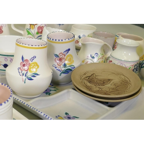 16 - A large collection of Poole Pottery in the traditional pattern, 1940s and later