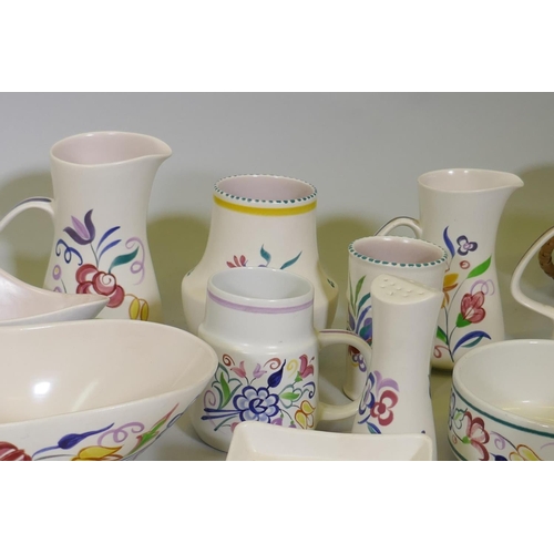 16 - A large collection of Poole Pottery in the traditional pattern, 1940s and later