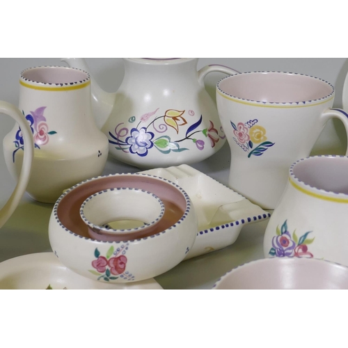 16 - A large collection of Poole Pottery in the traditional pattern, 1940s and later