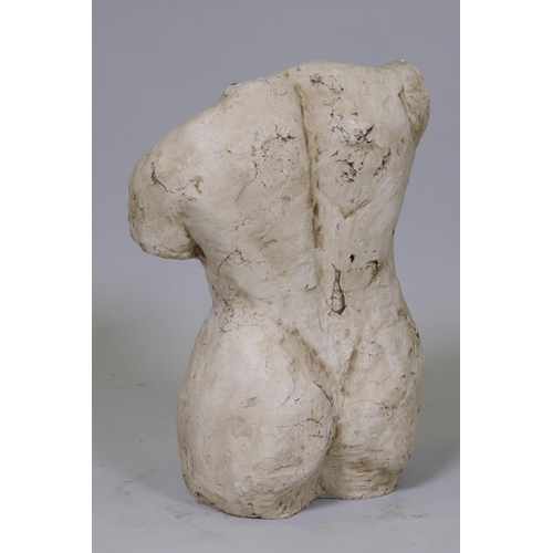 20 - A glazed terracotta study of a female torso, 44cm high