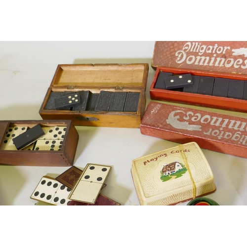 27 - A collection of vintage games, dominoes, cribbage, playing cards and 'Dog Derby'