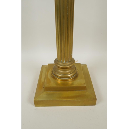 28 - A Victorian brass Corinthian column table lamp, 70cm high