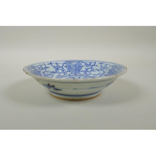 38 - A late C19th/early C20th Chinese blue and white porcelain dish decorated with bats and auspicious sy... 