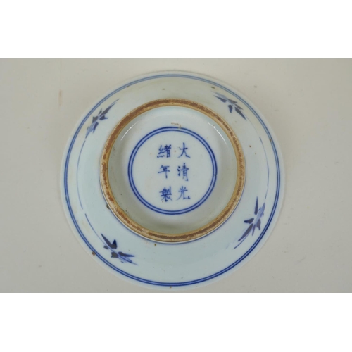 38 - A late C19th/early C20th Chinese blue and white porcelain dish decorated with bats and auspicious sy... 