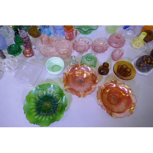 40 - A large collection of antique and later glassware, vases, tazza, carnival glass dishes, jelly moulds... 