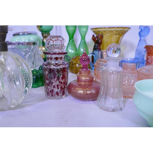 40 - A large collection of antique and later glassware, vases, tazza, carnival glass dishes, jelly moulds... 