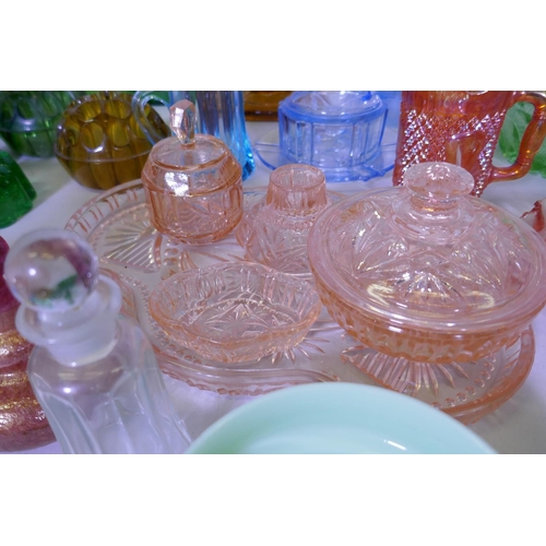 40 - A large collection of antique and later glassware, vases, tazza, carnival glass dishes, jelly moulds... 