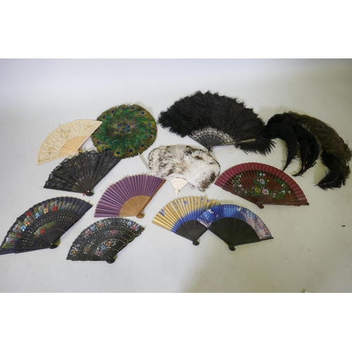 42 - An antique peacock feather fan, 33cm diameter, ostrich feather fans, lace and other fans