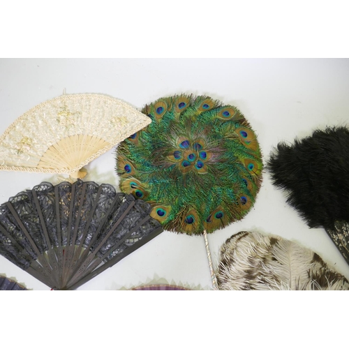 42 - An antique peacock feather fan, 33cm diameter, ostrich feather fans, lace and other fans