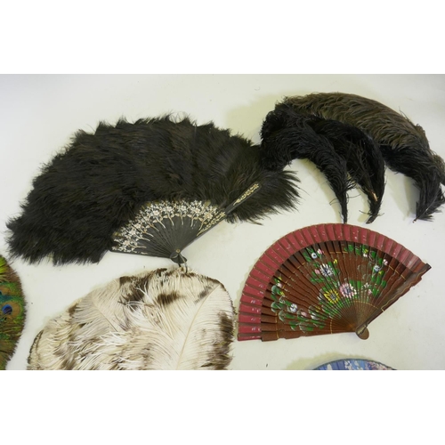 42 - An antique peacock feather fan, 33cm diameter, ostrich feather fans, lace and other fans