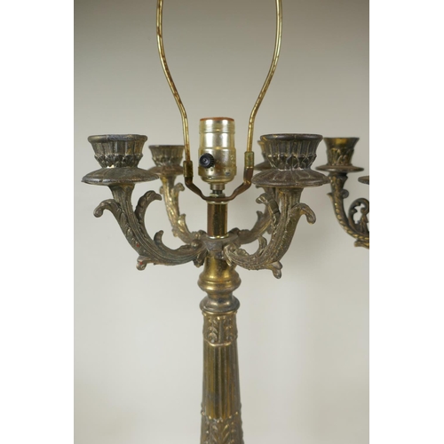 49 - A near pair of bronzed metal and faceted glass four branch column table lamps, 59cm high