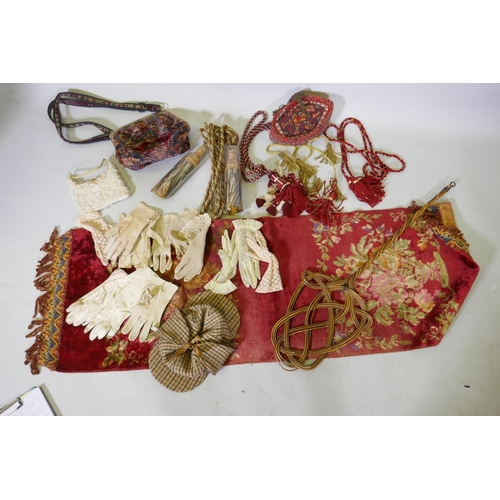 63 - A quantity of decorative tie-backs, vintage lace and leather gloves, Dunn & Co, deer stalker hat... 