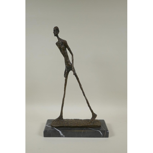 67 - After Alberto Giacometti, (Swiss, 1901-1966), L'homme qui Marche I, bronze figure on a marble base, ... 