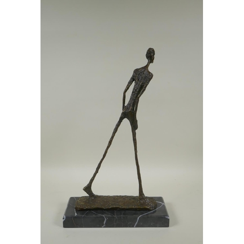 67 - After Alberto Giacometti, (Swiss, 1901-1966), L'homme qui Marche I, bronze figure on a marble base, ... 