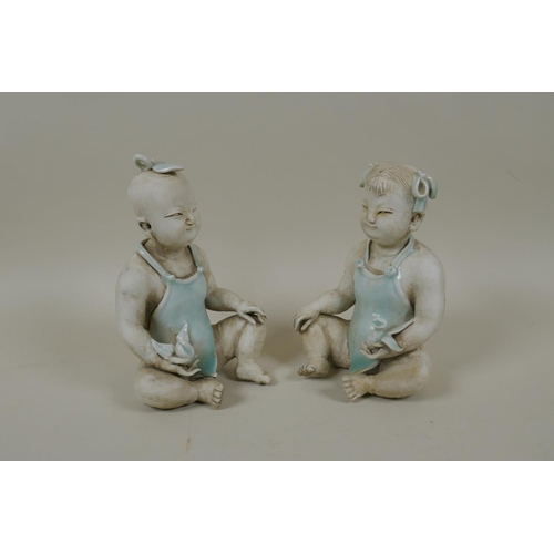 70 - A pair of Chinese song style figures of a boy and girl, 15cm high