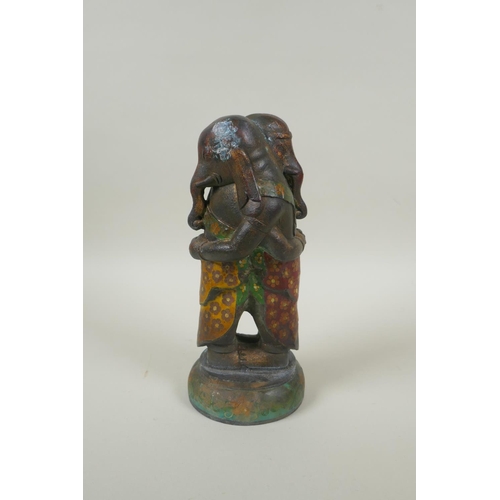 73 - A Chinese cast metal figure of two elephants embracing, with cloisonne clothing, 23cm high