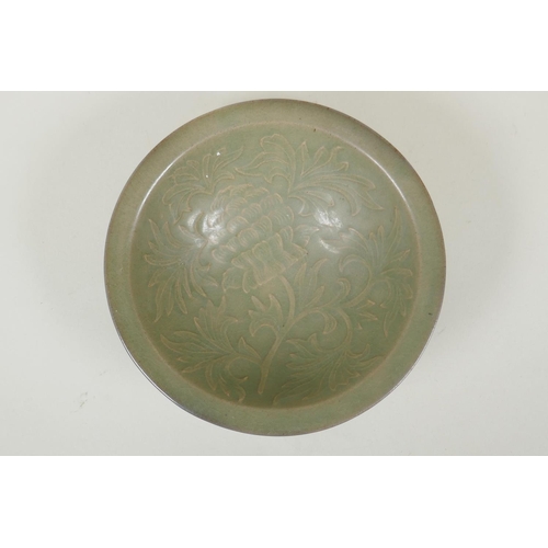 75 - A Chinese song style olive glazed porcelain double walled bowl with reticulated floral decoration to... 