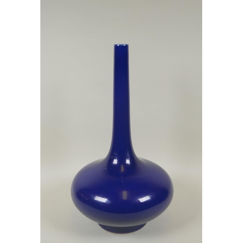 76 - A Chinese deep blue ground porcelain slender necked vase, KangXi 6 character mark to base, 39cm high