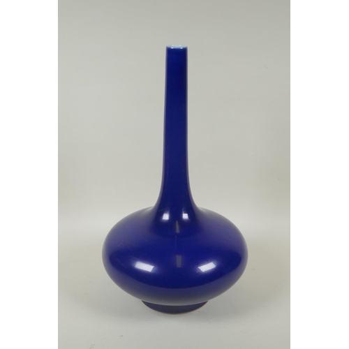 76 - A Chinese deep blue ground porcelain slender necked vase, KangXi 6 character mark to base, 39cm high