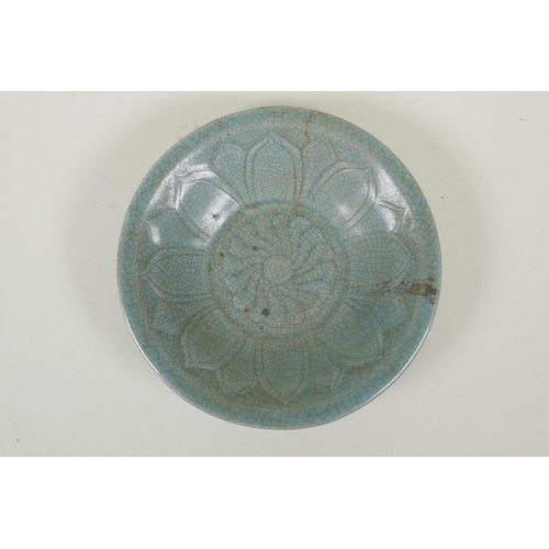 78 - A Chinese celadon crackleware bowl with incised lotus flower decoration, on a wood display stand, 16... 