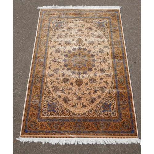 1144 - A fine silk Iranian cream ground rug with tradition floral medallion design, 152 x 226cm