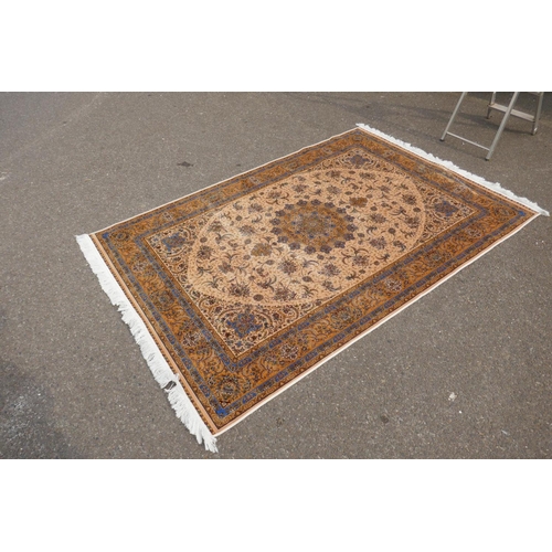 1144 - A fine silk Iranian cream ground rug with tradition floral medallion design, 152 x 226cm