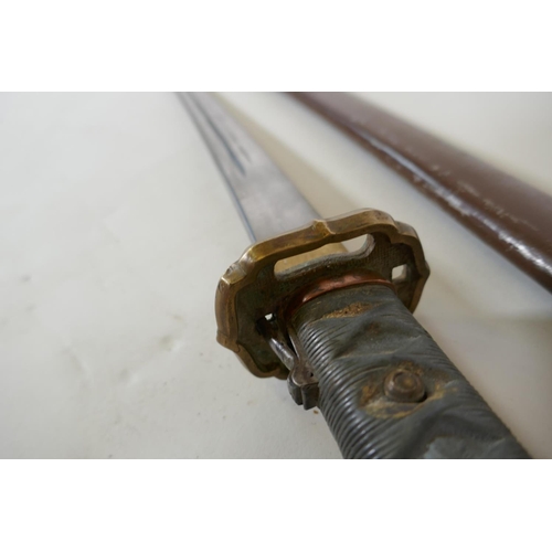 10 - A copy of a WWII Japanese Imperial Army NCO's Type 95 Shin Gunto sword with aluminium hilt and brass... 