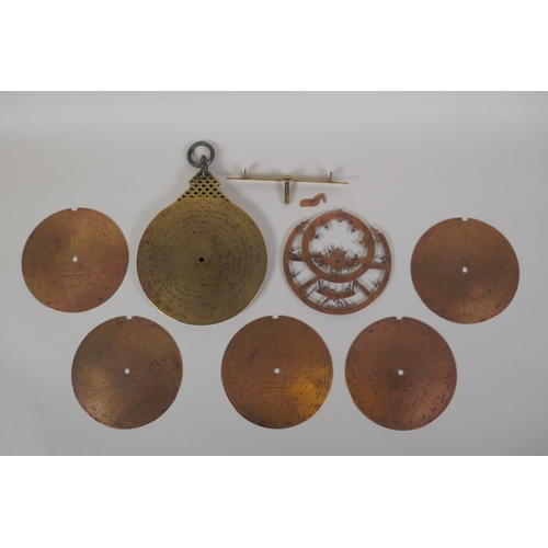 11 - An Islamic antique fine silver inlaid brass Astrolabe, with silver stars and five interchangeable do... 
