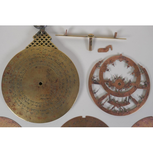 11 - An Islamic antique fine silver inlaid brass Astrolabe, with silver stars and five interchangeable do... 