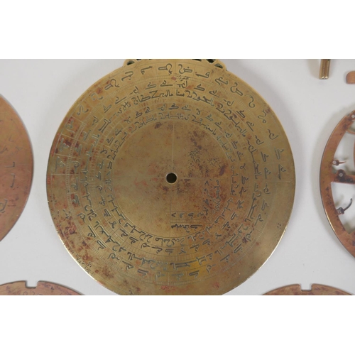 11 - An Islamic antique fine silver inlaid brass Astrolabe, with silver stars and five interchangeable do... 