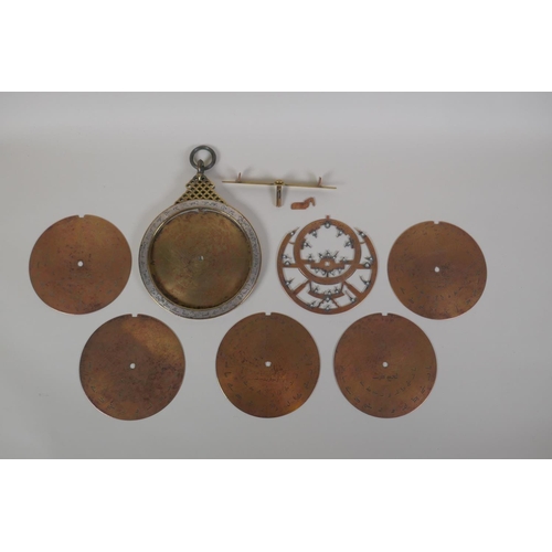 11 - An Islamic antique fine silver inlaid brass Astrolabe, with silver stars and five interchangeable do... 