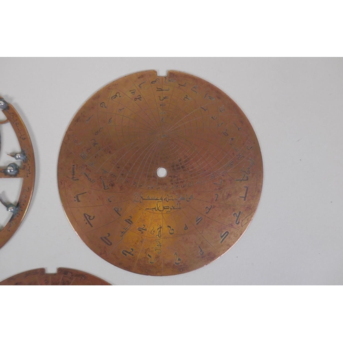 11 - An Islamic antique fine silver inlaid brass Astrolabe, with silver stars and five interchangeable do... 