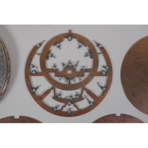 11 - An Islamic antique fine silver inlaid brass Astrolabe, with silver stars and five interchangeable do... 