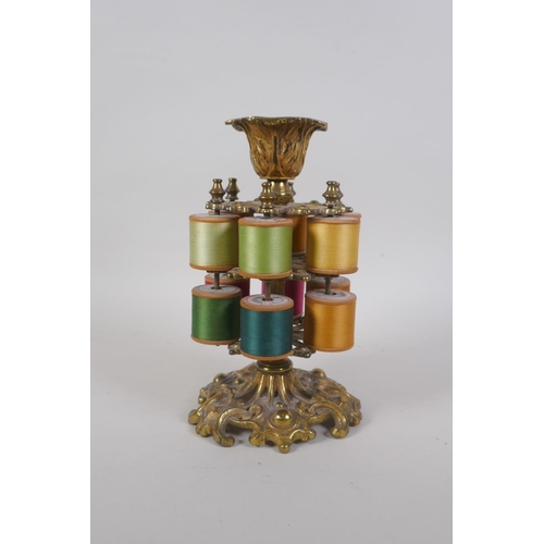 12 - A Victorian gilt brass two tier sewing spool holder, 20cm high