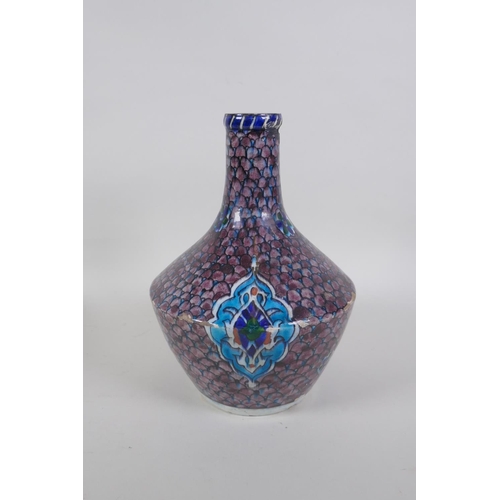 14 - An antique Persian blue and white glazed flask with boteh design, and another Perisan Iznik design p... 