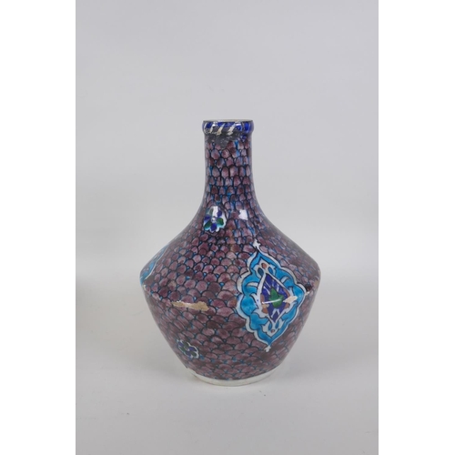 14 - An antique Persian blue and white glazed flask with boteh design, and another Perisan Iznik design p... 