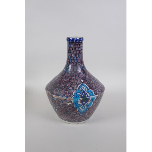 14 - An antique Persian blue and white glazed flask with boteh design, and another Perisan Iznik design p... 