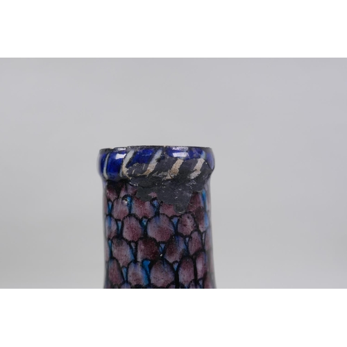 14 - An antique Persian blue and white glazed flask with boteh design, and another Perisan Iznik design p... 