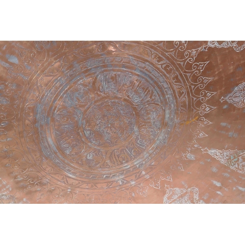 20 - A large C18th Ottoman copper tray, signed Master Al-Muhammad Al-Din Hesam Rezani, further inscribed ... 