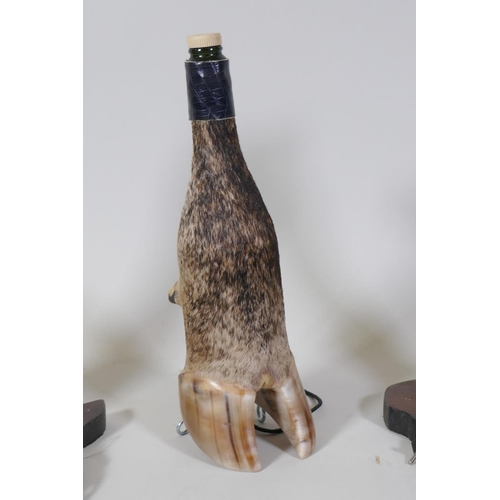 24 - A pair of African Zebra hoof taxidermy lamp bases, 41cm high, and a hoof decanter