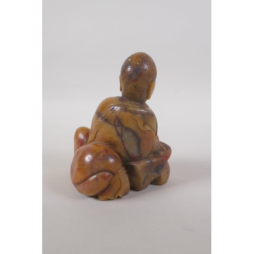 25 - A Chinese carved soapstone figure of Lohan, 14cm high
