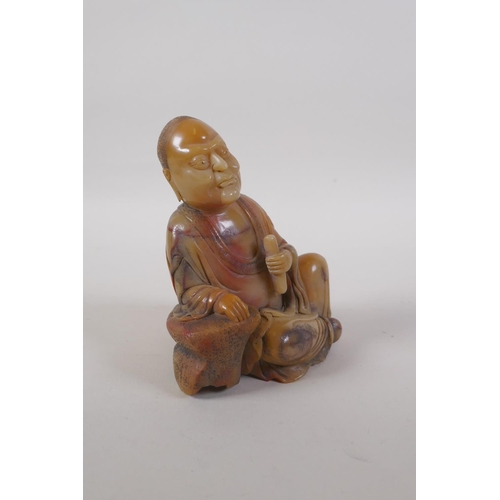 25 - A Chinese carved soapstone figure of Lohan, 14cm high