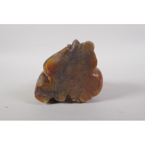 25 - A Chinese carved soapstone figure of Lohan, 14cm high